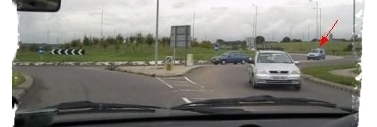 Approaching a roundabout and assessing the traffic flow